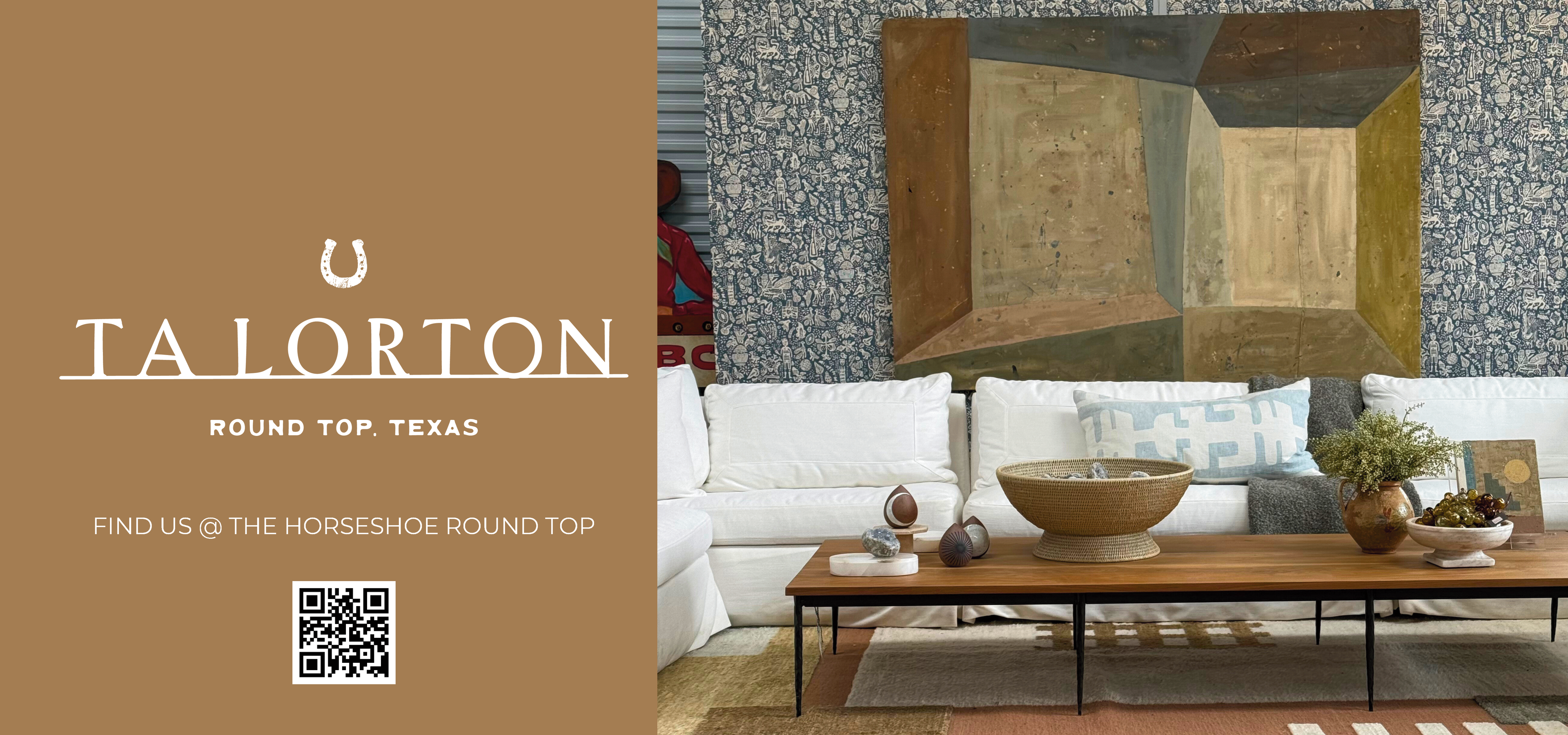 Living room with white sofa, wooden coffee table, and abstract painting on a textured wall. Talorton branding visible.
